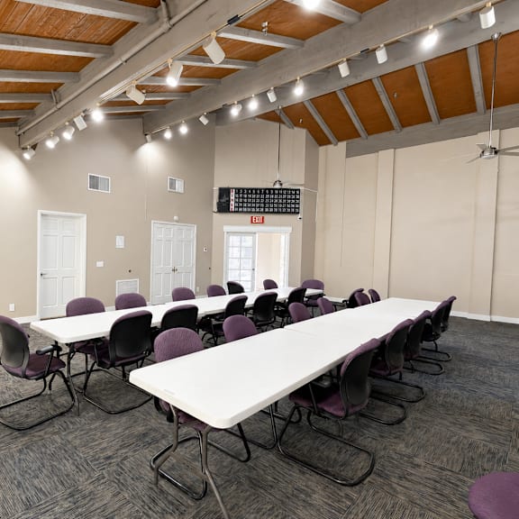 a conference room with a long table and chairs.