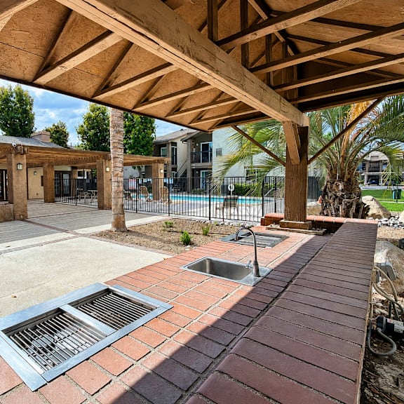 a building with a wooden roof and a brick walkway.