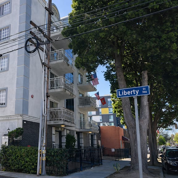 a street view of a building with a sign that reads "liberty".