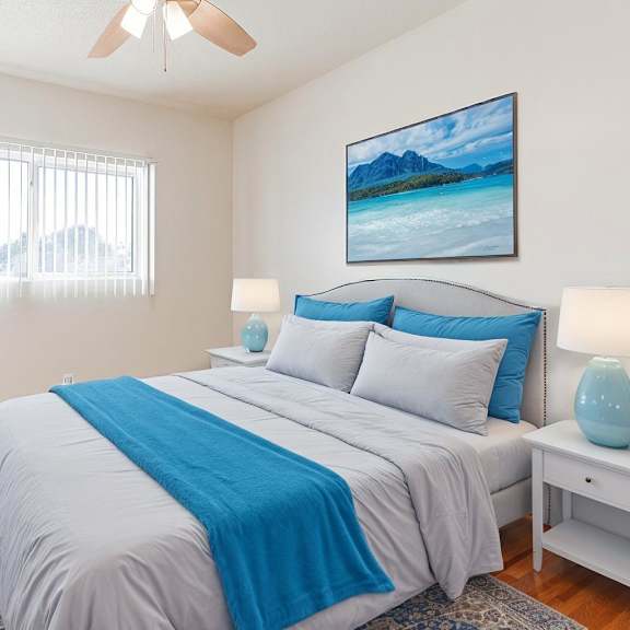 a bedroom with a bed, nightstand, and a painting on the wall.