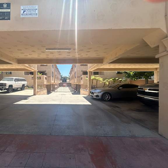 a parking garage with a concrete floor and a concrete ceiling.