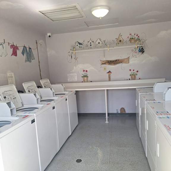 a laundromat with washers and dryers.