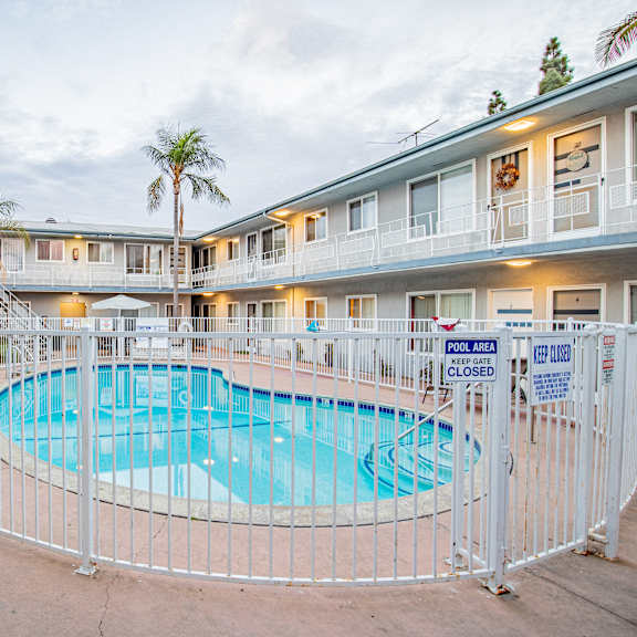 a pool area is fenced off and closed.