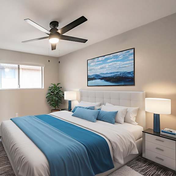 a bedroom with a bed, a ceiling fan, and a painting on the wall.