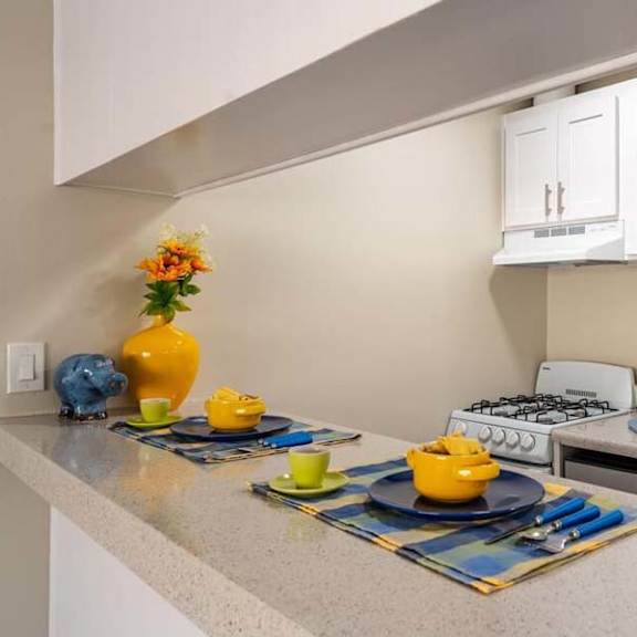 a kitchen with a stove top oven next to a sink at mountainview venture, covina, 91722