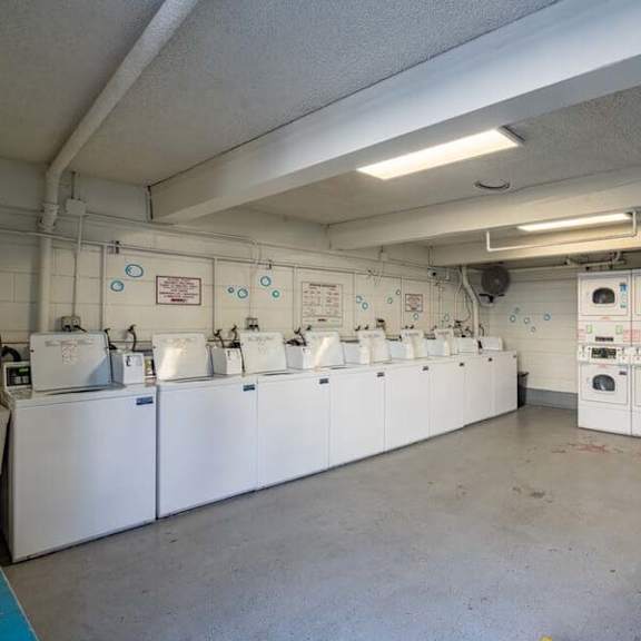 a room filled with lots of white washers and dryers at mountainview venture, california, 91722