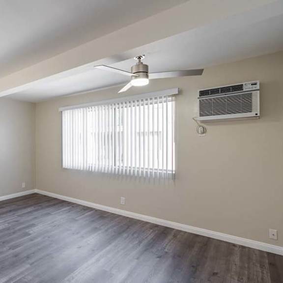 an empty room with a ceiling fan and a window at mountainview venture, california, 91722
