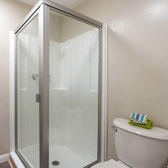 a bathroom with a shower and a toilet at mountainview venture, covina, ca