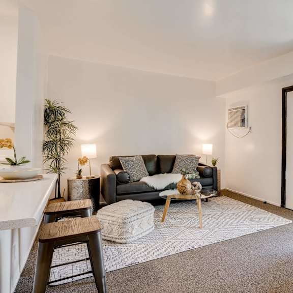 a living room with a couch and a chair at university park, azusa, ca 91702