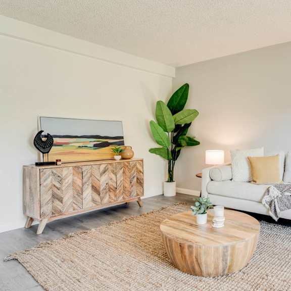 a living room with a couch and a coffee table at university park, azusa california
