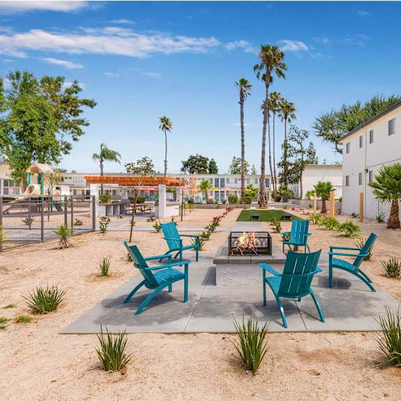 an outside patio with chairs and a fire pit at sunnymead apts apartments, moreno valley, 92553