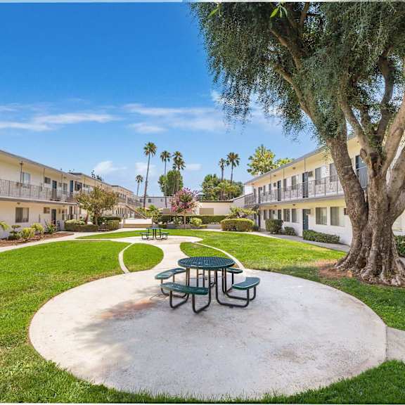 a park with a picnic table and a tree in a courtyard at sunnymead apts apartments, california, 92553
