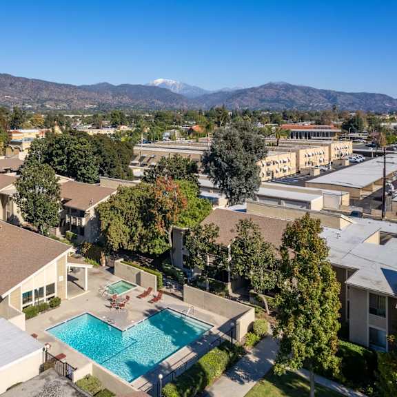 a aerial view of a pool and buildings in a city at alosta place, california, 91702
