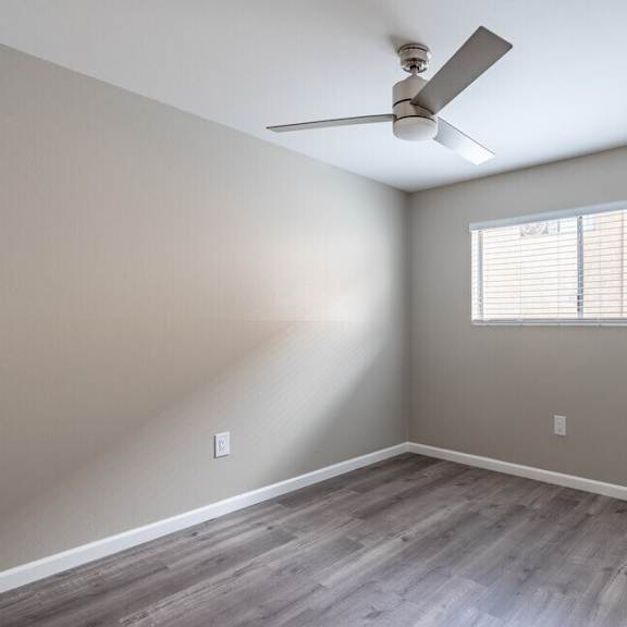 an empty room with a ceiling fan and a window at north view terrace, california