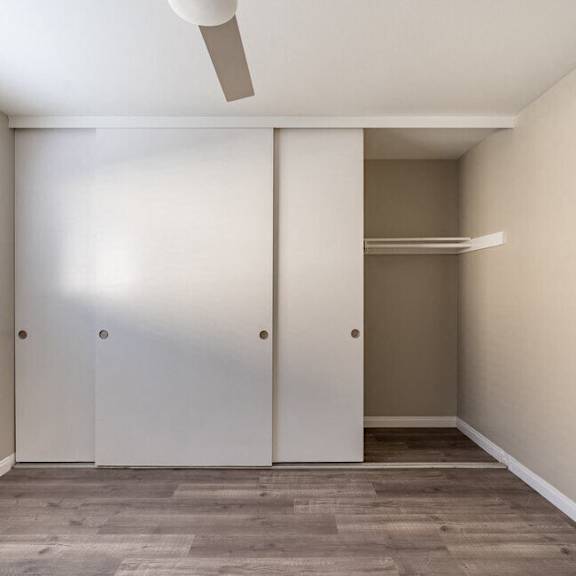 an empty room with a closet and a window at north view terrace, montebello