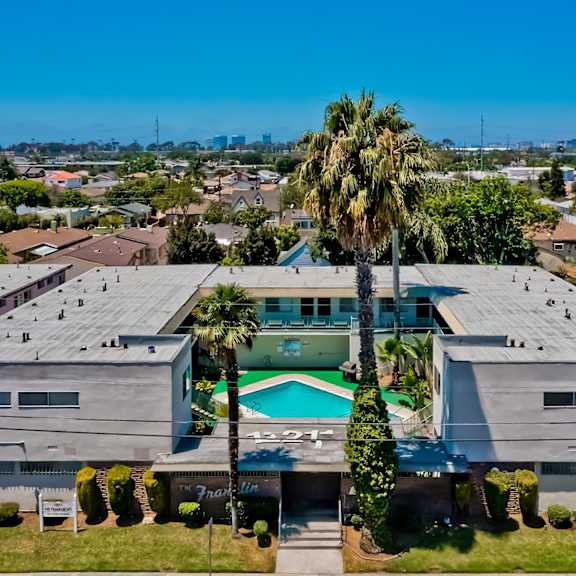 a large building with a pool in the middle of it.