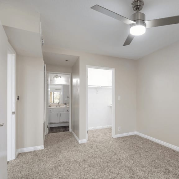 an empty living room with a ceiling fan at huntington terrace north senior, california, 92648