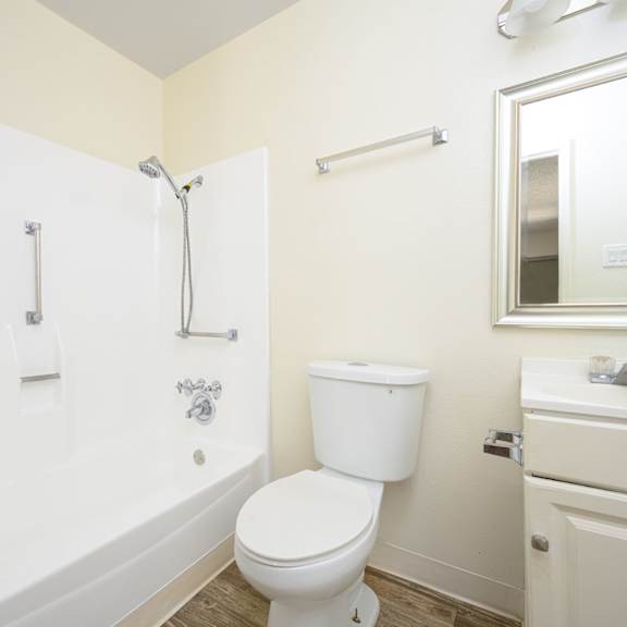 a bathroom with a bathtub and a toilet at villa hemet, hemet, ca 92543
