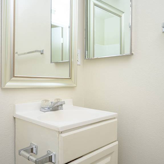 a bathroom with a sink and a mirror  at villa hemet, hemet, ca 92543