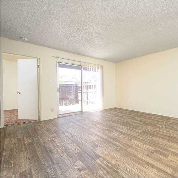 a bedroom with hardwood floors and white walls at villa hemet, california, 92543