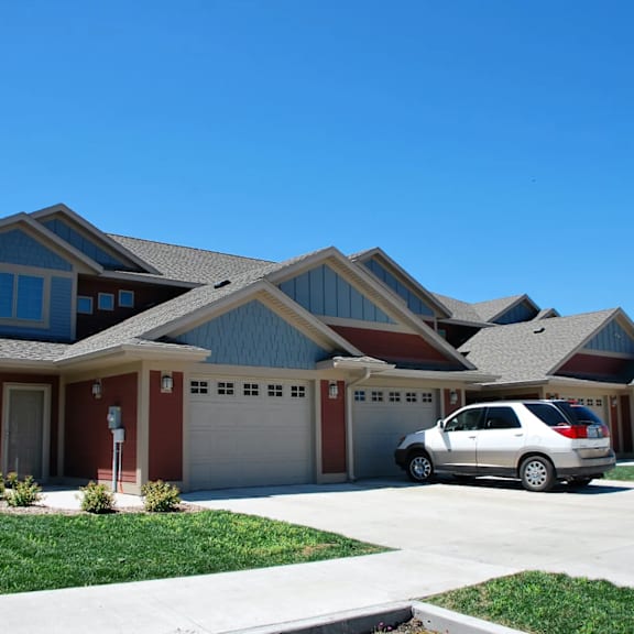 a house with a car parked in front.