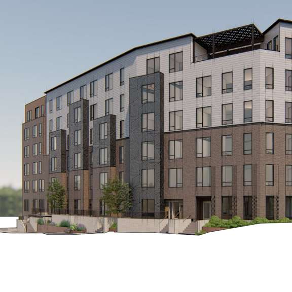 a modern multi-story apartment building with a mix of dark and light brown balconies.