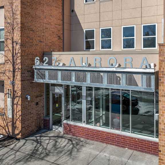 a building with a glass door and windows.