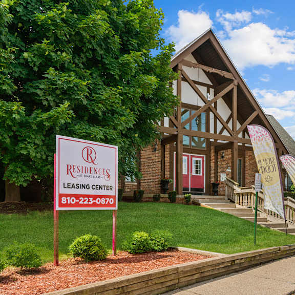 leasing center exterior at residences at grand blanc apartments - grand blanc, mi, michigan, 48507