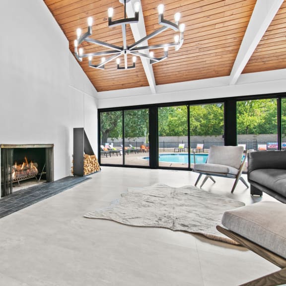 a living room with a fireplace and sliding glass doors