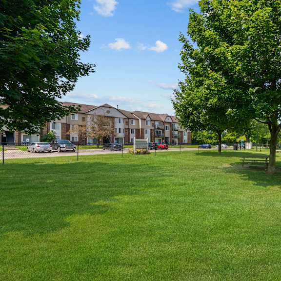 lush green landscape at residences at grand blanc apartments - grand blanc, mi, michigan, 48507