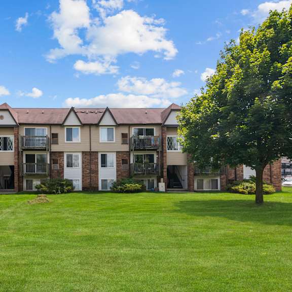 lush green outdoor at residences at grand blanc apartments - grand blanc, mi, michigan