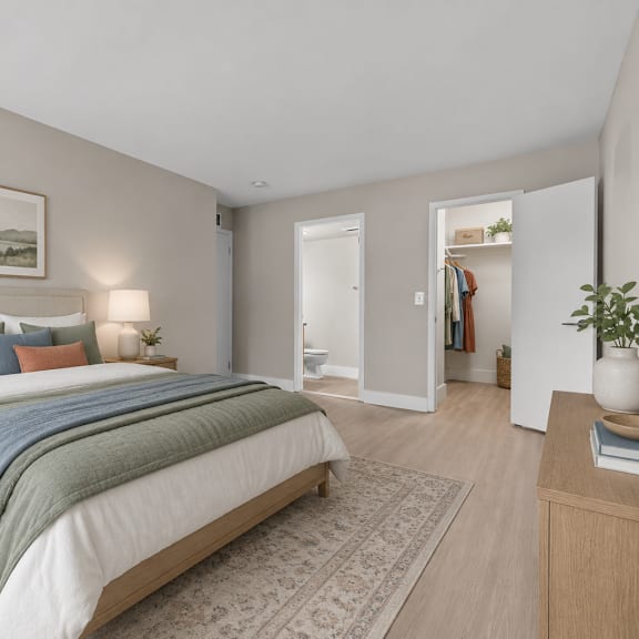 a bedroom with a large bed and a painting above it.