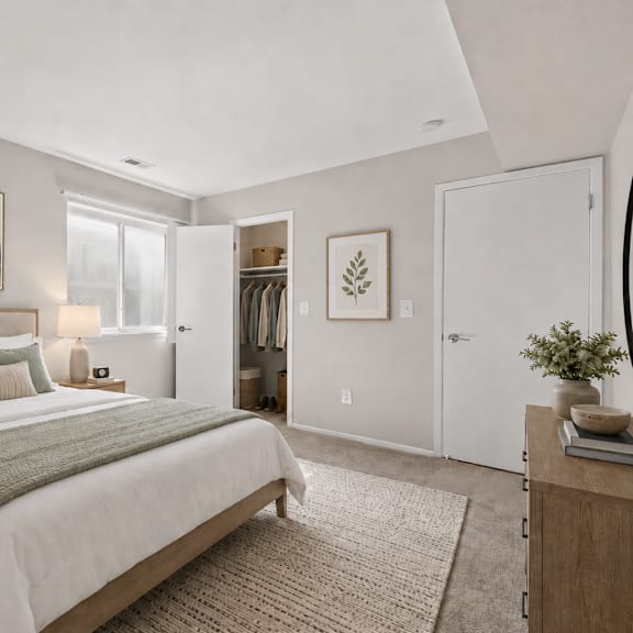 a bedroom with a large bed and a painting on the wall.