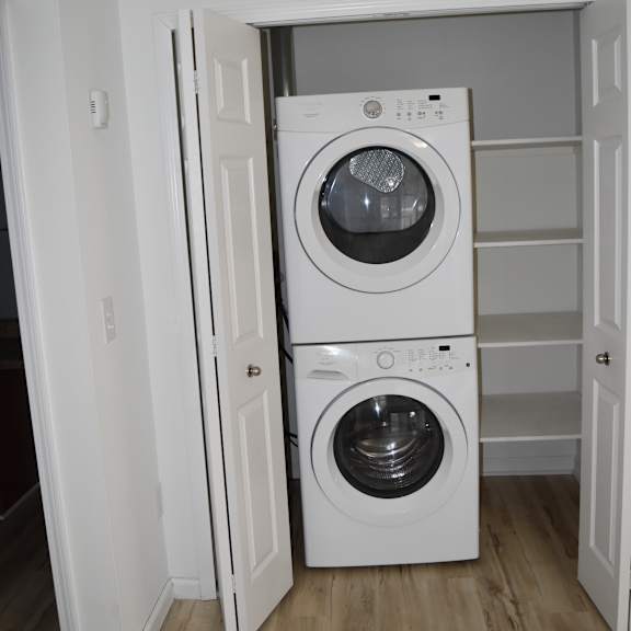 a washing machine and dryer are installed in a wall at sunnymede apartments in troy, mi