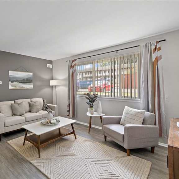 living room at residences at grand blanc apartments - grand blanc, mi, michigan
