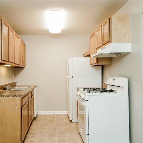 fully furnished kitchen at residences at grand blanc apartments - grand blanc, mi, michigan