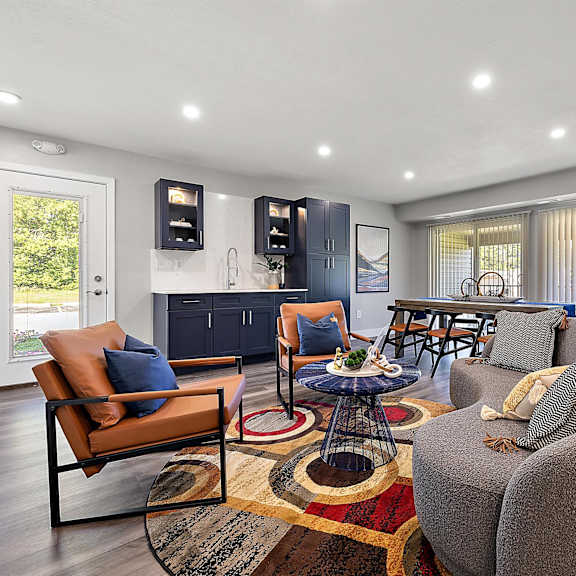 a living room with a couch and a table at sunnymede apartments - troy, mi, michigan