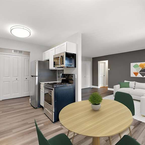 a living room and dining room with a table and chairs at sunnymede apartments - troy, mi, troy, 48084