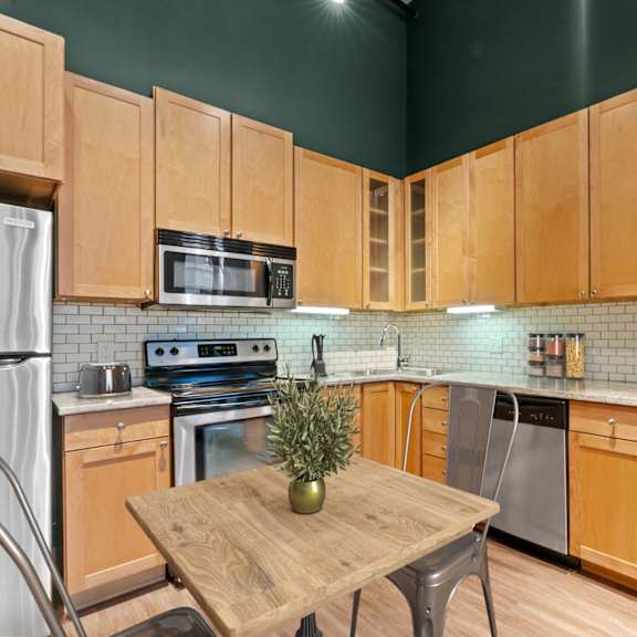 Thumbnail 3 of 13 Kitchen and living area. Lowertown Lofts  in St. Paul, MN 3 Bedroom 2.5 Bath Plus Den Apartment  at Lowertown Lofts, Minnesota