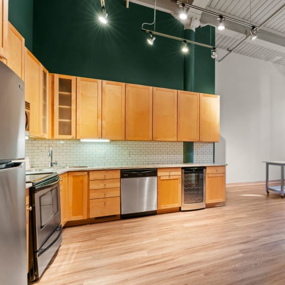 Thumbnail 2 of 13 Kitchen and living area. Lowertown Lofts  in St. Paul, MN 3 Bedroom 2.5 Bath Plus Den Apartment  at Lowertown Lofts, Minnesota