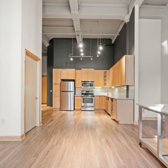 Thumbnail 4 of 13 Kitchen and living area. Lowertown Lofts  in St. Paul, MN 3 Bedroom 2.5 Bath Plus Den Apartment  at Lowertown Lofts, Minnesota