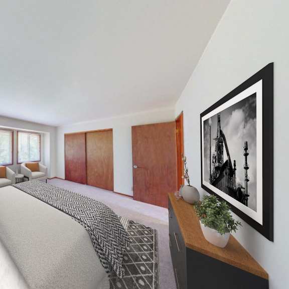 a bedroom with a large bed and two windows