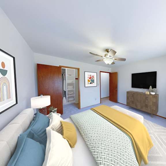 a bedroom with a bed and a ceiling fan