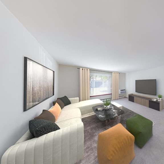 a living room with a white couch and a television