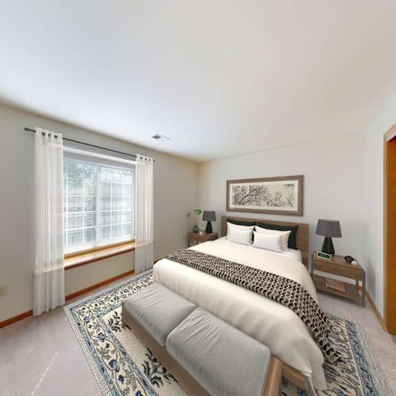 a bedroom with a large bed and a window with curtains.