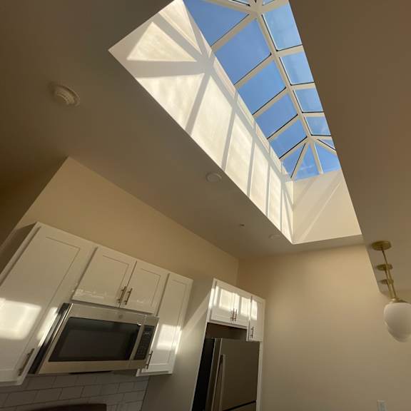 a skylight in the ceiling of a kitchen