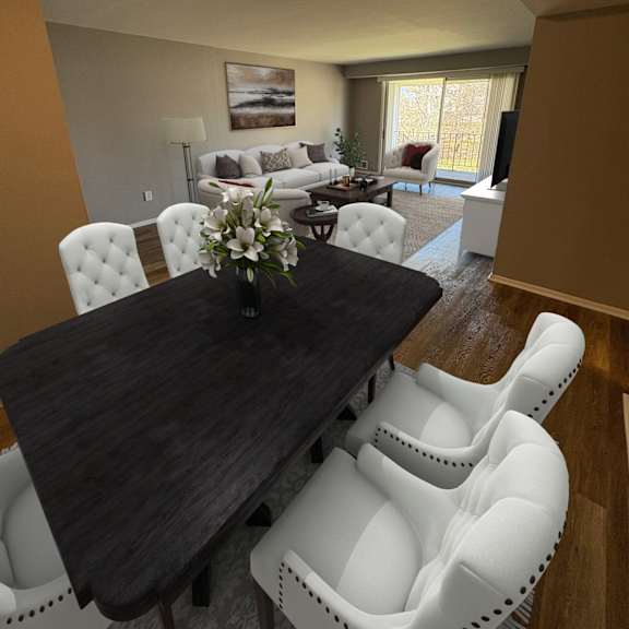 a dining room with a wooden table and white chairs.