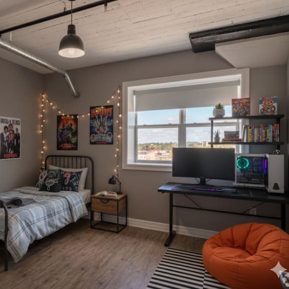 a room with a bed, desk, and a window.