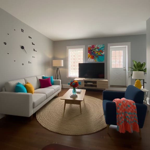 a living room with a white couch, a blue chair, and a wooden coffee table.