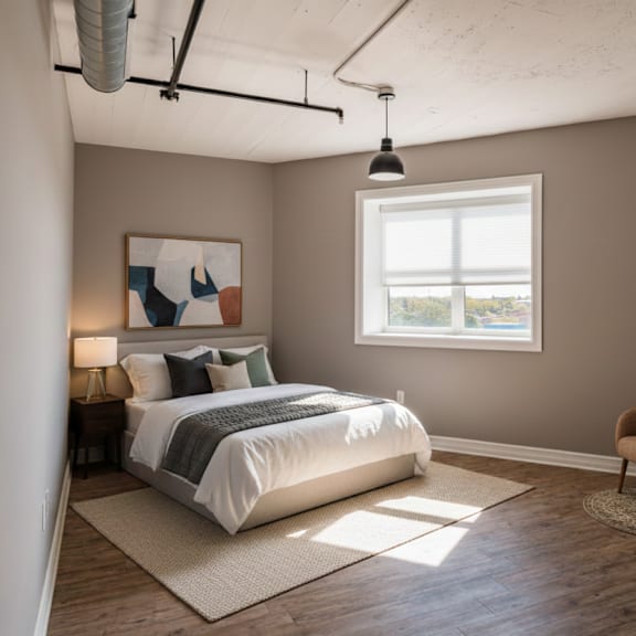 a bedroom with a large bed and a painting on the wall.
